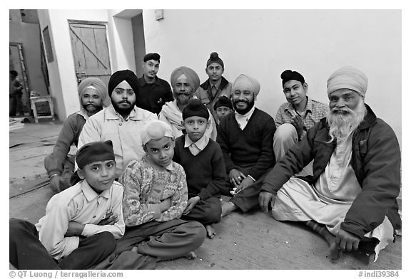 Sikh men and boys in gurdwara. Bharatpur, Rajasthan, India (black and white)