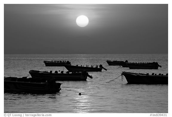 Boats anchored in bay and sunrise, Dona Paula. Goa, India (black and white)