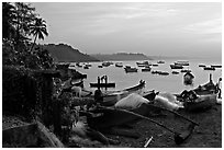 Fishing boats on beach, sunrise. Goa, India (black and white)