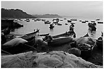 Fishing nets and boats, sunrise. Goa, India (black and white)