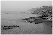 Coastline, palm trees, and clear waters, Dona Paula. Goa, India (black and white)