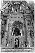 Gilded and carved woodwork, Church of St Francis of Assisi altar, Old Goa. Goa, India (black and white)