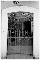 Gate, yard, and house, Panjim. Goa, India (black and white)
