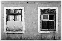 Windows on facade painted blue, Panjim. Goa, India ( black and white)