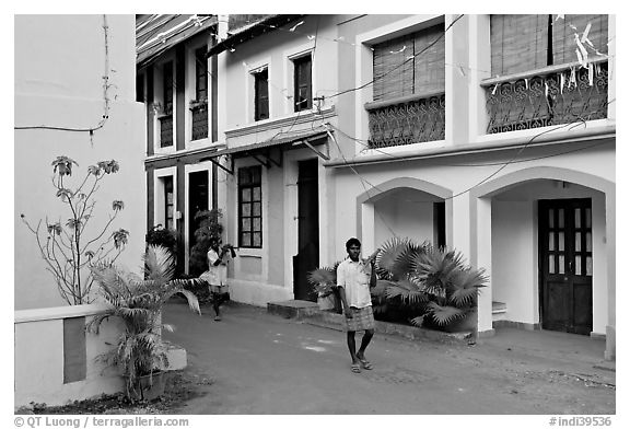 Men returning from work with tools, Panjim. Goa, India (black and white)
