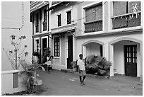 Men returning from work with tools, Panjim. Goa, India (black and white)