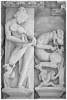 Sculpture of woman removing thorn from foot, Parsvanatha temple, Eastern Group. Khajuraho, Madhya Pradesh, India (black and white)