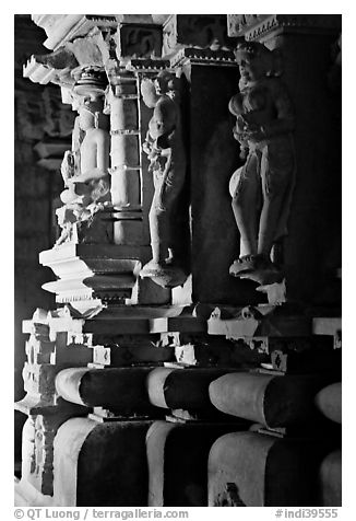 Statues in the corridor (pradakshina), Parsvanatha temple, Eastern Group. Khajuraho, Madhya Pradesh, India (black and white)