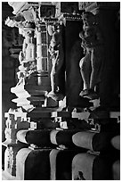 Statues in the corridor (pradakshina), Parsvanatha temple, Eastern Group. Khajuraho, Madhya Pradesh, India (black and white)