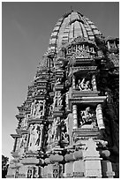 Bands of carved sculptures below spire (sikhara), Javari Temple, Eastern Group. Khajuraho, Madhya Pradesh, India (black and white)