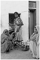Women cooking outside in village. Khajuraho, Madhya Pradesh, India (black and white)