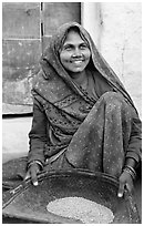 Woman sorting grains. Khajuraho, Madhya Pradesh, India ( black and white)