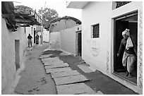 Alley in village. Khajuraho, Madhya Pradesh, India (black and white)