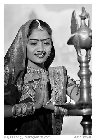 Woman joining hands in prayer gesture, Kandariya show. Khajuraho, Madhya Pradesh, India