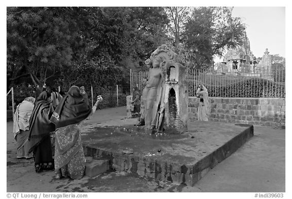 Women throwing water at  Shiva image. Khajuraho, Madhya Pradesh, India (black and white)