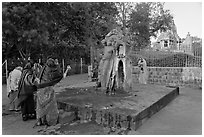 Women throwing water at  Shiva image. Khajuraho, Madhya Pradesh, India (black and white)