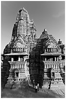 Lakshmana temple seen from Matangesvara temple, with people looking. Khajuraho, Madhya Pradesh, India ( black and white)