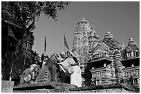 Worshippers making offering at Matangesvara temple with  Lakshmana behind. Khajuraho, Madhya Pradesh, India ( black and white)