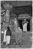 Women climbing up stairs on Matangesvara temple. Khajuraho, Madhya Pradesh, India (black and white)