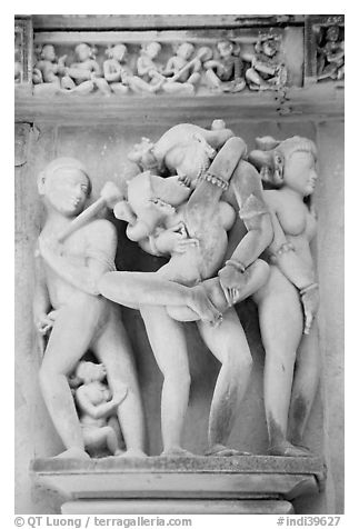 Erotic sculpture of couple in embrace, Lakshmana temple. Khajuraho, Madhya Pradesh, India (black and white)