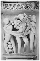 Erotic sculpture of couple in embrace, Lakshmana temple. Khajuraho, Madhya Pradesh, India (black and white)