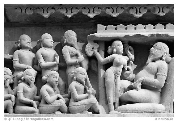 Sculpture of royal court scene, Lakshmana temple. Khajuraho, Madhya Pradesh, India (black and white)