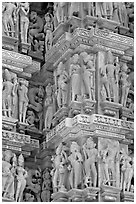 Sculptural details with apsaras, Kadariya-Mahadev temple. Khajuraho, Madhya Pradesh, India (black and white)