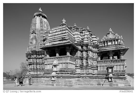 Devi Jagadamba temple with women walking. Khajuraho, Madhya Pradesh, India