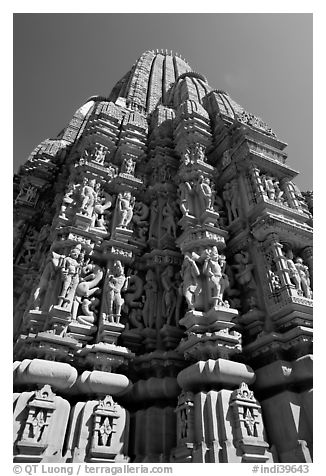 Sculptures and sikhara of Devi Jagadamba temple from below. Khajuraho, Madhya Pradesh, India (black and white)