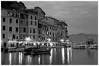 Houses reflected in harbor at dusk, Portofino. Liguria, Italy ( black and white)