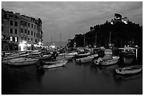 Harbor and San Giorgio castle at dusk, Portofino. Liguria, Italy ( black and white)