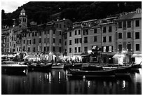 Pastes-colored houses around harbor at dusk, Portofino. Liguria, Italy (black and white)