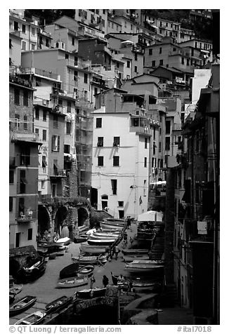 Plazza with parked boats built along steep ravine, Riomaggiore. Cinque Terre, Liguria, Italy (black and white)