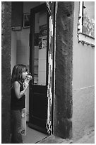 Girl enjoying gelato (ice-cream), Vernazza. Cinque Terre, Liguria, Italy ( black and white)