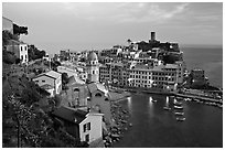 Harbor, church, medieval castle and village, sunset, Vernazza. Cinque Terre, Liguria, Italy ( black and white)