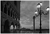 Lamp, column with Lion, Piazza San Marco (Square Saint Mark) at dawn. Venice, Veneto, Italy (black and white)