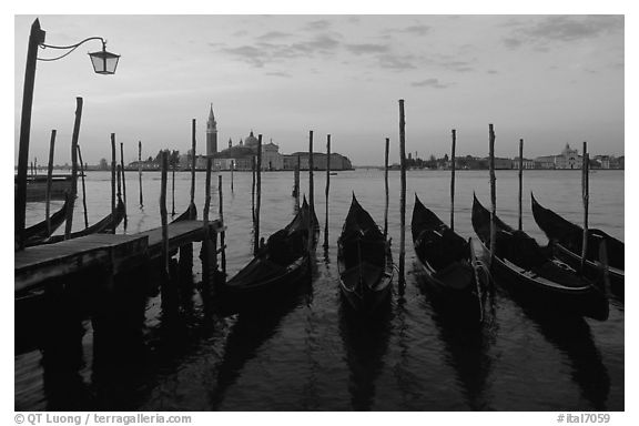 Parked gondolas, Canale della Guidecca, San Giorgio Maggiore church at dawn. Venice, Veneto, Italy