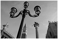 Lamps, Campanile, column with Lion, Piazza San Marco (Square Saint Mark), early morning. Venice, Veneto, Italy ( black and white)
