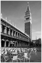 Campanile, Zecca, and empty chairs, Piazza San Marco (Square Saint Mark), early morning. Venice, Veneto, Italy (black and white)