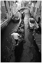 Gondolas lined up in narrow canal. Venice, Veneto, Italy ( black and white)
