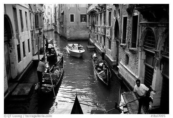 Busy water trafic in  narrow canal. Venice, Veneto, Italy