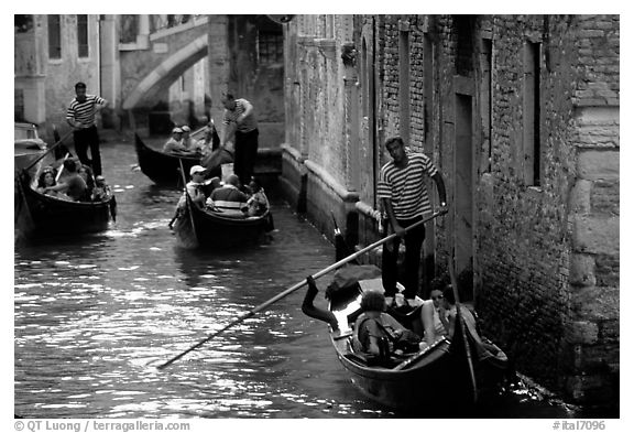 Several gondolas in a narrow canal. Venice, Veneto, Italy (black and white)