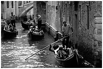 Several gondolas in a narrow canal. Venice, Veneto, Italy (black and white)