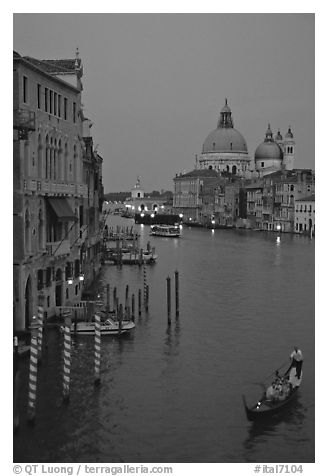 Gondola, Grand Canal, Santa Maria della Salute church from the Academy Bridge, dusk. Venice, Veneto, Italy