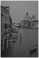 Gondola, Grand Canal, Santa Maria della Salute church from the Academy Bridge, dusk. Venice, Veneto, Italy ( black and white)