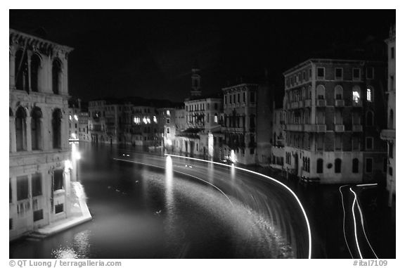 Light trails on the Grand Canal at night near the Rialto Bridge. Venice, Veneto, Italy