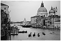 Gondolas, Grand Canal, Santa Maria della Salute church from the Academy Bridge, dusk. Venice, Veneto, Italy (black and white)