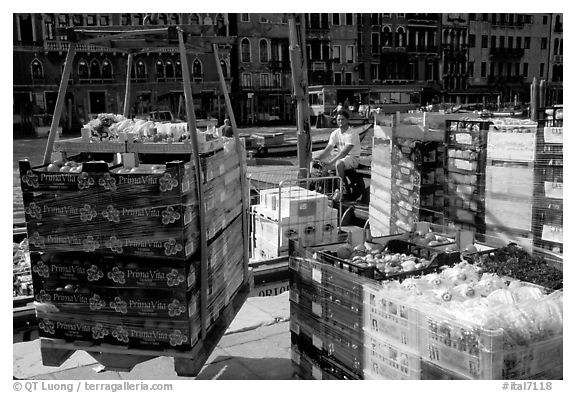 Delivery of fresh produce from the Grand Canal. Venice, Veneto, Italy (black and white)