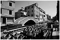 Delivery of wine along a side canal, Castello. Venice, Veneto, Italy (black and white)