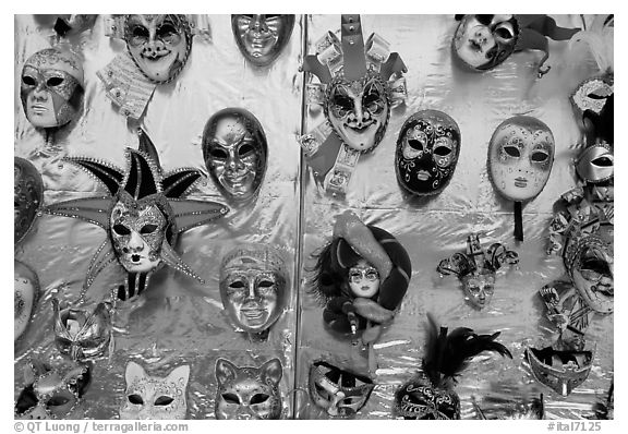 Carnival masks over golden background, Burano. Venice, Veneto, Italy (black and white)
